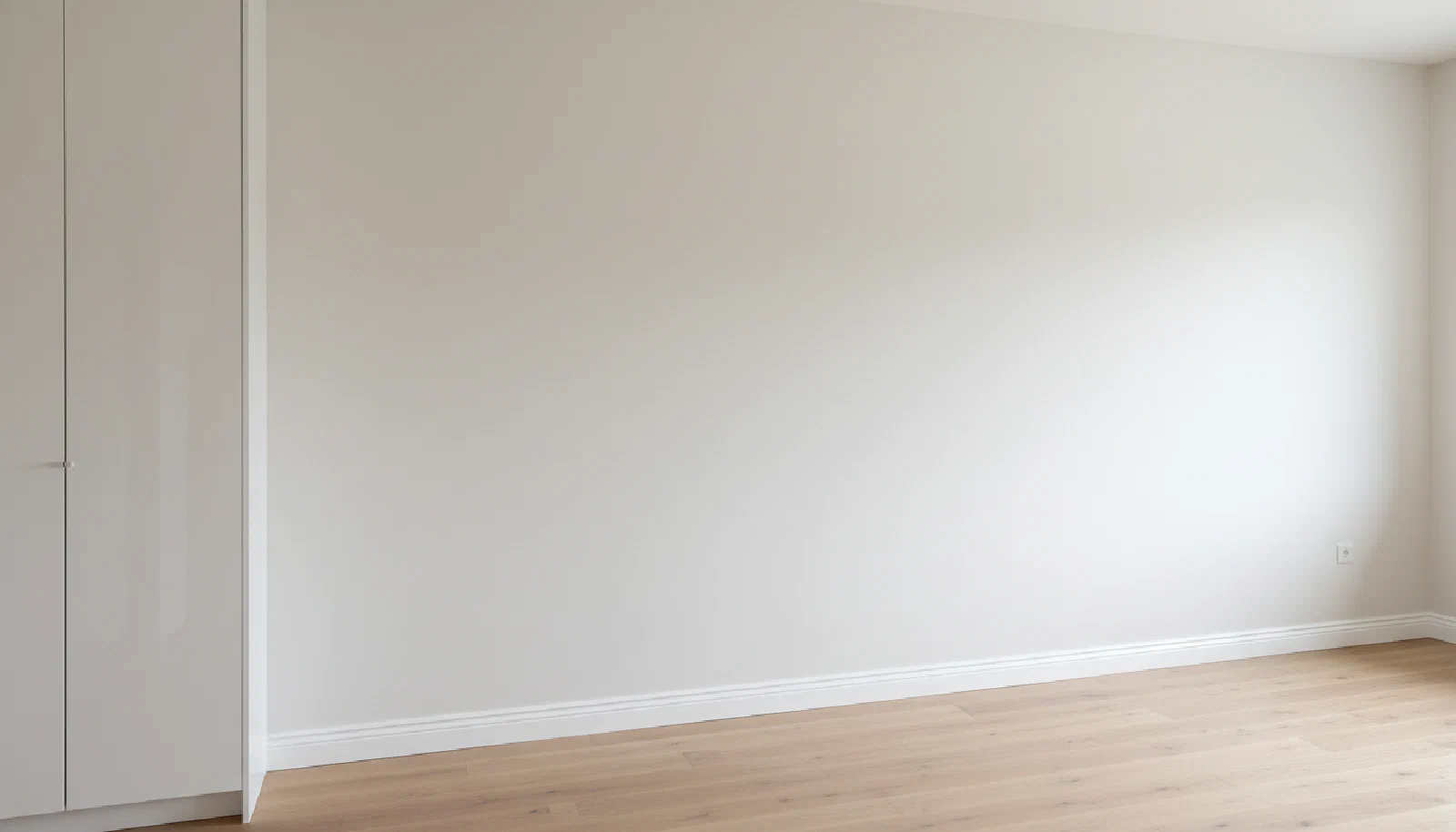 Bright finished room with smooth walls after seamless drywall repair